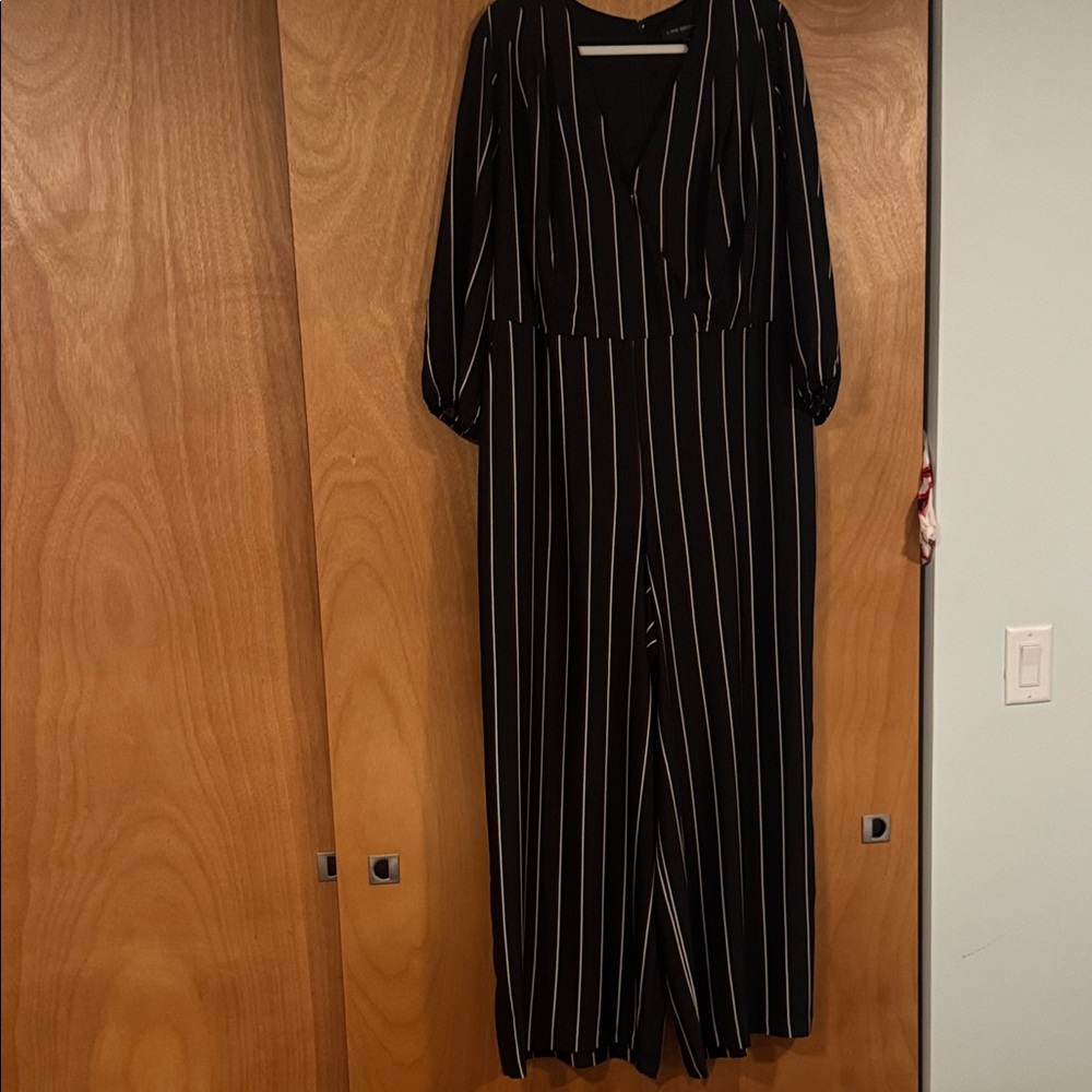 Classic Lane Bryant Black and White Striped Jumpsuit with matching tie belt.
